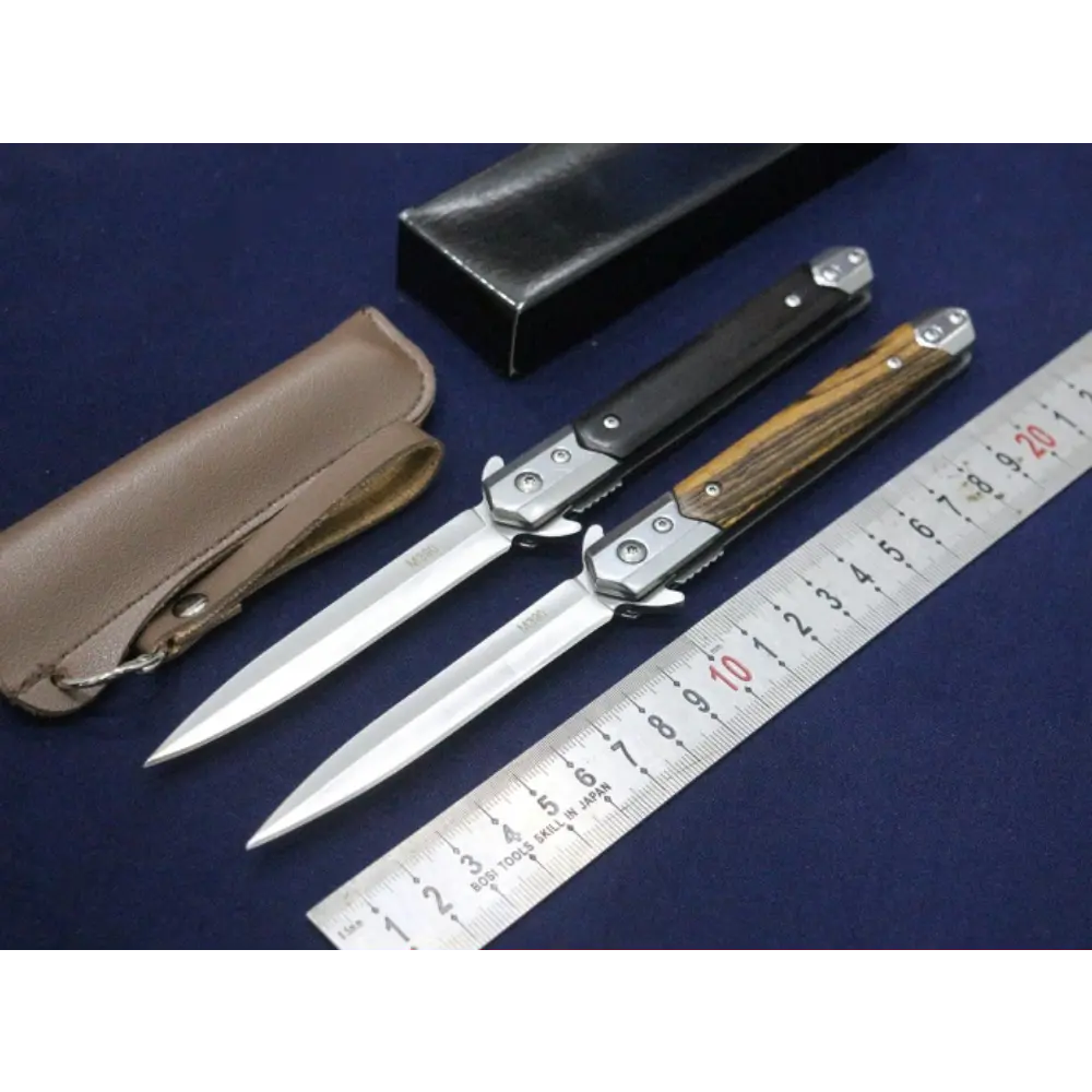 DEFENSE KNIFE WITH ROPE CUTTER ON THE BOTTOM AND MULTI DESIGNS